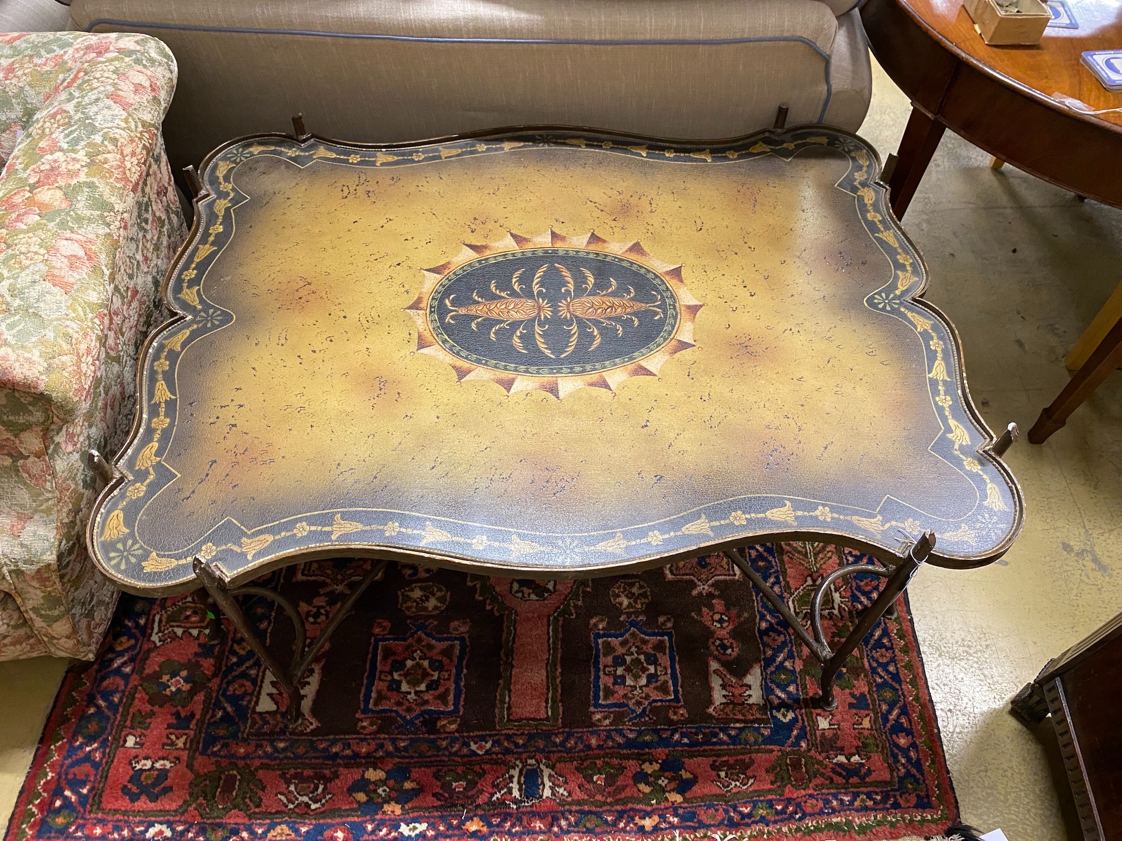 A painted wrought iron coffee table, width 122cm, depth 94cm, height 56cm